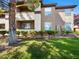 Beautiful multi-level condo building with well-manicured landscaping, green lawn, and fresh curb appeal at 231 W Horizon Ridge Pkwy # 212, Henderson, NV 89012