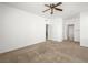 Spacious main bedroom featuring neutral walls, carpeted floors and ceiling fan at 231 W Horizon Ridge Pkwy # 212, Henderson, NV 89012