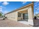 The backyard patio has privacy shades and desert landscaping at 2453 Vivid Sky Pl, Henderson, NV 89044