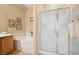 Bathroom with separate shower and tub, featuring framed artwork and neutral decor at 2453 Vivid Sky Pl, Henderson, NV 89044