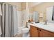 Bathroom featuring a single sink vanity and a shower/tub combination with a grab bar at 2453 Vivid Sky Pl, Henderson, NV 89044