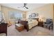 Bedroom featuring natural light, a ceiling fan and traditional furnishings at 2453 Vivid Sky Pl, Henderson, NV 89044