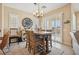 Dining area with wood table, seating for four and natural light at 2453 Vivid Sky Pl, Henderson, NV 89044