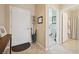 Welcoming foyer with tiled floors, white door and trim, and seamless transition to other living spaces at 2453 Vivid Sky Pl, Henderson, NV 89044