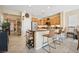 Open kitchen with bar seating and stainless steel appliances at 2453 Vivid Sky Pl, Henderson, NV 89044