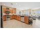 Spacious kitchen with stainless steel appliances, wooden cabinets, and large island, perfect for entertaining at 2453 Vivid Sky Pl, Henderson, NV 89044