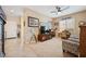 Comfortable living room showcasing tiled floors, an open layout, and seamless transition to other spaces at 2453 Vivid Sky Pl, Henderson, NV 89044