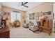 Cozy living room showcasing comfortable seating, neutral tones, and abundant natural light at 2453 Vivid Sky Pl, Henderson, NV 89044