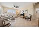Comfortable living room with tile floors and neutral décor at 2453 Vivid Sky Pl, Henderson, NV 89044