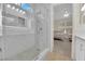Bathroom features a glass shower, marble countertops and flooring, and double sinks at 2633 Spider Cactus Ct, Las Vegas, NV 89106