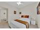 Charming bedroom with a neatly made bed and a view into another room at 2633 Spider Cactus Ct, Las Vegas, NV 89106