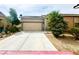 Charming single-story home featuring a two-car garage and low maintenance desert landscaping at 2633 Spider Cactus Ct, Las Vegas, NV 89106