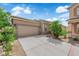 Charming single-story home featuring a two-car garage, desert landscaping, and a well-maintained front yard at 2633 Spider Cactus Ct, Las Vegas, NV 89106
