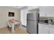 Bright kitchen and dining area with stainless steel refrigerator at 2633 Spider Cactus Ct, Las Vegas, NV 89106