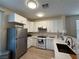 Updated kitchen featuring white cabinets, stainless steel appliances, and sleek countertops at 2633 Spider Cactus Ct, Las Vegas, NV 89106
