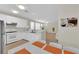 Contemporary kitchen featuring white appliances, sleek countertops, and open layout at 2633 Spider Cactus Ct, Las Vegas, NV 89106