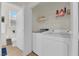Functional laundry area with modern appliances and a convenient toilet at 2633 Spider Cactus Ct, Las Vegas, NV 89106