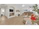 Bright open-concept living room with modern decor, wood floors, and an electric fireplace at 2633 Spider Cactus Ct, Las Vegas, NV 89106