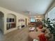 Bright living room with hardwood floors and stylish decor seamlessly flowing into the kitchen at 2633 Spider Cactus Ct, Las Vegas, NV 89106