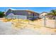 View of the backyard surrounded by a chain link fence at 280 Gentry St, Overton, NV 89040