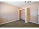 Bedroom features carpet flooring, neutral paint, and a small closet at 280 Gentry St, Overton, NV 89040