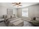 Cozy bedroom featuring a plush bed, stylish furniture, and plenty of natural light at 280 Gentry St, Overton, NV 89040