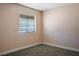 Bedroom featuring carpet flooring, neutral paint, and a window with blinds at 280 Gentry St, Overton, NV 89040