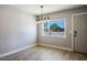 Inviting dining room with a large window, modern lighting, and neutral paint at 280 Gentry St, Overton, NV 89040