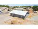 Exterior view showcasing the property's modern metal roof and desert landscape surroundings at 280 Gentry St, Overton, NV 89040