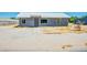 Charming single-story home with a gray stucco exterior and a metal roof at 280 Gentry St, Overton, NV 89040