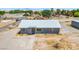 Exterior of house with metal roof, decorative door and gravel landscape at 280 Gentry St, Overton, NV 89040