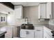 Bright kitchen featuring stainless steel appliances, modern fixtures, and open layout to living area at 280 Gentry St, Overton, NV 89040