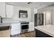 Modern kitchen featuring stainless steel appliances, white cabinetry, and stylish countertops at 280 Gentry St, Overton, NV 89040
