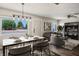 Bright, staged living and dining area with modern decor and a large window providing natural light at 280 Gentry St, Overton, NV 89040