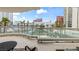 Spacious balcony featuring glass railings, overlooking meticulously maintained landscape, and distant city views at 2857 Paradise Rd # 401, Las Vegas, NV 89109