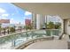 Balcony with glass railings overlooking a pool, palm trees, and the city skyline in Las Vegas at 2857 Paradise Rd # 401, Las Vegas, NV 89109