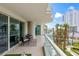 Open air balcony with seating, glass railings and tropical views at 2857 Paradise Rd # 401, Las Vegas, NV 89109