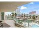 Balcony with glass railings, outdoor seating and tropical views of the area at 2857 Paradise Rd # 401, Las Vegas, NV 89109