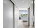 Inviting bedroom with sliding closet door leading to sitting area with city views and a comfortable armchair at 2857 Paradise Rd # 401, Las Vegas, NV 89109