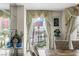 A dining room features a scenic view framed by elegant drapes, offering a glimpse of the outdoors at 2857 Paradise Rd # 401, Las Vegas, NV 89109