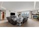 Open living room with large tv, fireplace, comfortable seating, and access to the balcony at 2857 Paradise Rd # 401, Las Vegas, NV 89109