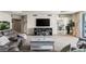 Spacious living room with seating, tv, and views into the dining room at 2857 Paradise Rd # 401, Las Vegas, NV 89109