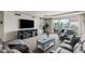 Cozy living room featuring plush seating, tv, balcony access, and plenty of natural light at 2857 Paradise Rd # 401, Las Vegas, NV 89109