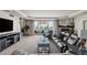 Comfortable living room featuring a large tv, fireplace, plush seating, and balcony access at 2857 Paradise Rd # 401, Las Vegas, NV 89109