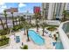 A swimming pool with surrounding lounge chairs and palm trees is the focal point of this photo at 2857 Paradise Rd # 401, Las Vegas, NV 89109