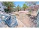 Backyard featuring a brick patio, sparse landscaping, and a shed at 2906 Cedar Ave, Las Vegas, NV 89101