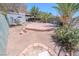 Backyard featuring a brick patio, sparse landscaping, and a shed at 2906 Cedar Ave, Las Vegas, NV 89101