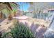 Backyard featuring a brick patio, sparse landscaping, and a shed at 2906 Cedar Ave, Las Vegas, NV 89101