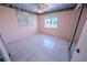 Bedroom features tile flooring, base molding, window, and a double-door closet at 2906 Cedar Ave, Las Vegas, NV 89101