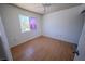 Bedroom with natural light from window, features wood-look flooring and white walls at 2906 Cedar Ave, Las Vegas, NV 89101